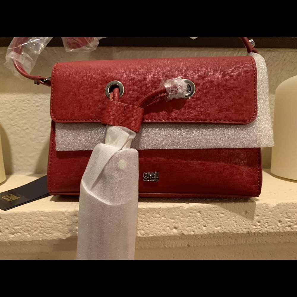 A dark red Robert Cavalli handbag
